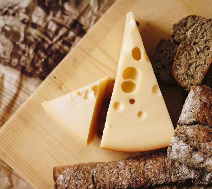sliced cheese on brown table top