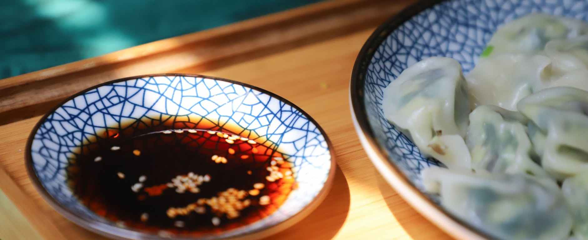 round blue saucer filled with soy sauce