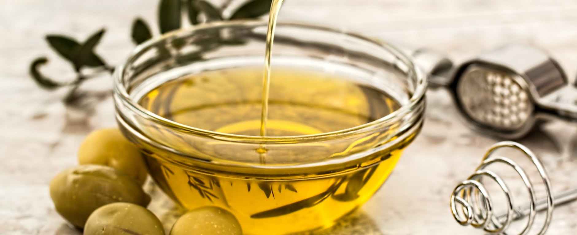 bowl being poured with yellow liquid