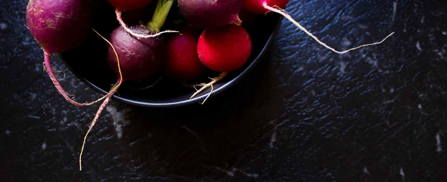 purple and red radish in bowl