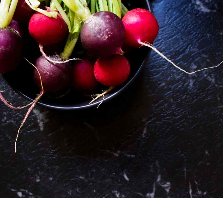 purple and red radish in bowl