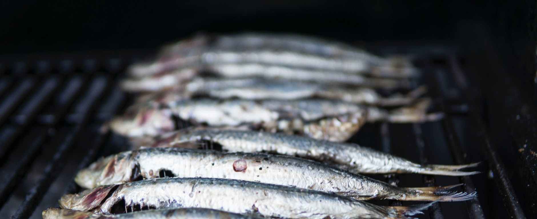 photo of raw fish on grill