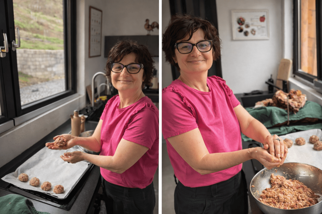 Woman shaping meatballs in a bright kitchen while preparing food by hand